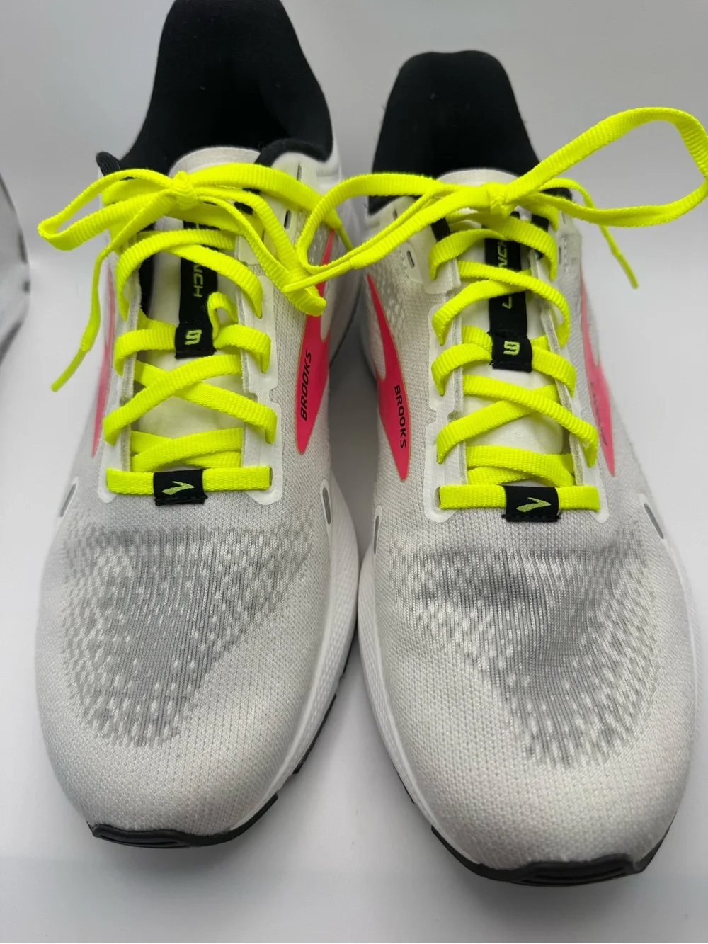 Brooks White Running Shoes with Neon Yellow Laces and Pink Accents